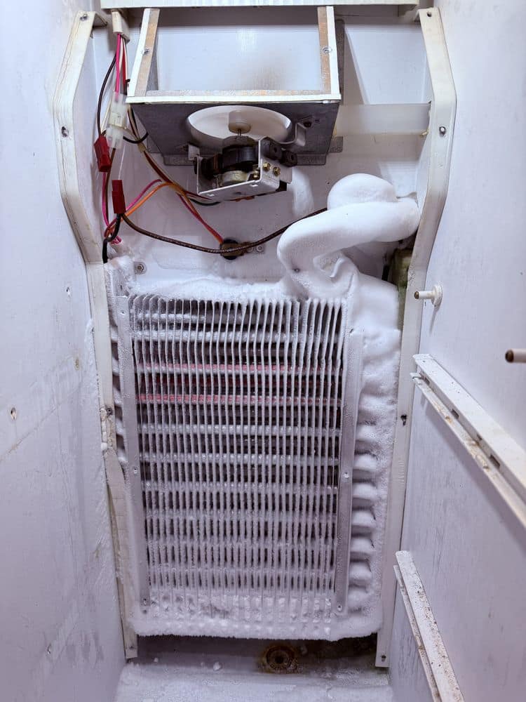 Freezer defrost system repair — ice buildup removed