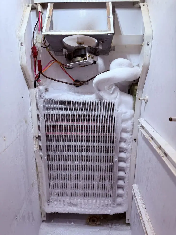 Freezer defrost system repair — ice buildup removed
