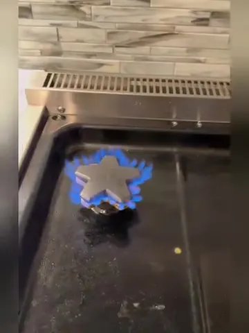 Gas range burner with an even blue flame after service