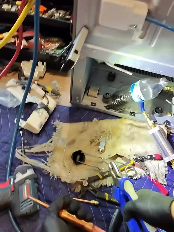 Refrigerator sealed system repair with gauges and brazing tools
