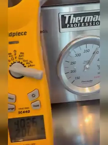 Thermador professional range oven temperature being checked with a meter