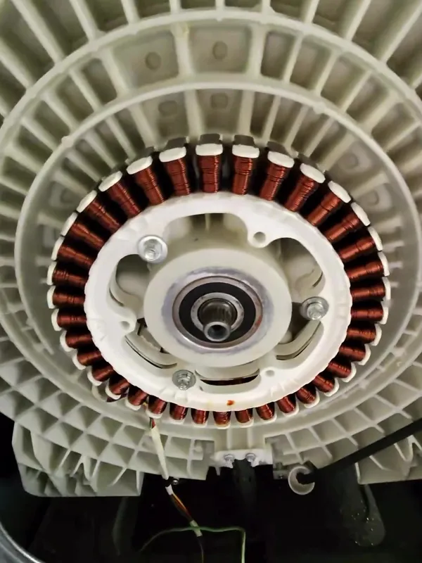Front-load washer motor stator exposed during repair