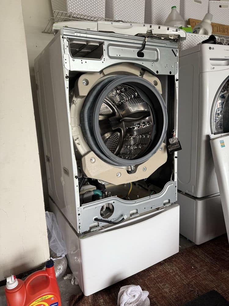 Front-load washer drum and bearing repair in progress